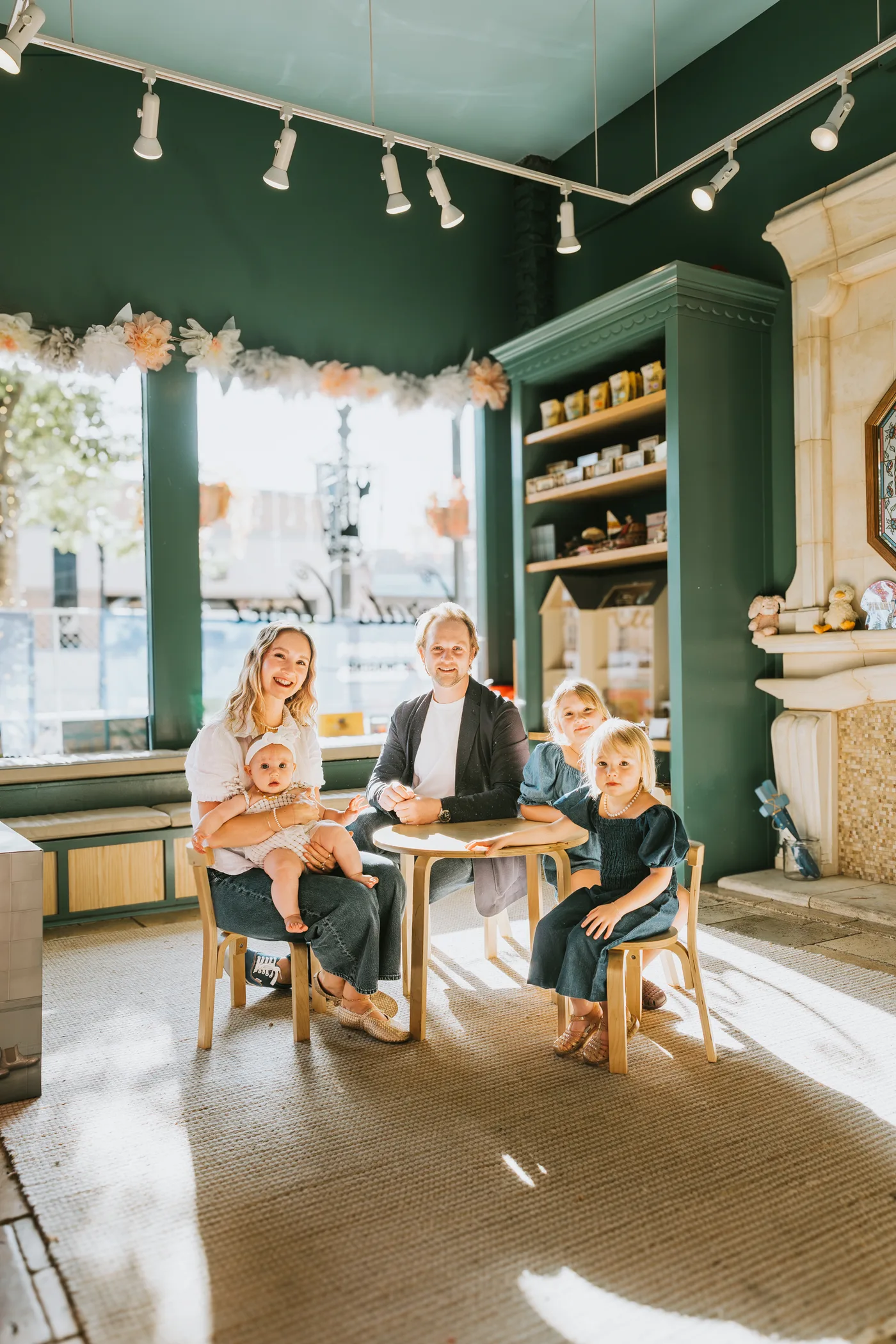 The Barnes family together with their baby in the Corals Closet toy store