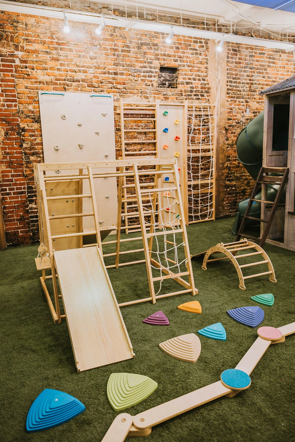 Wooden climbing frames and balance paths in the play space