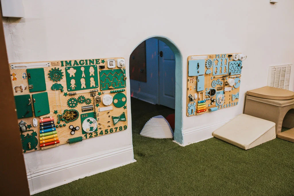 Interactive sensory activity boards in the play space